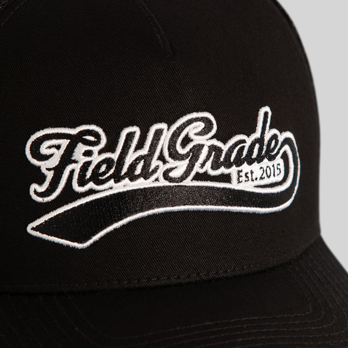 FIELD GRADE COLLEGIATE BLACK TWILL MESH TRUCKER