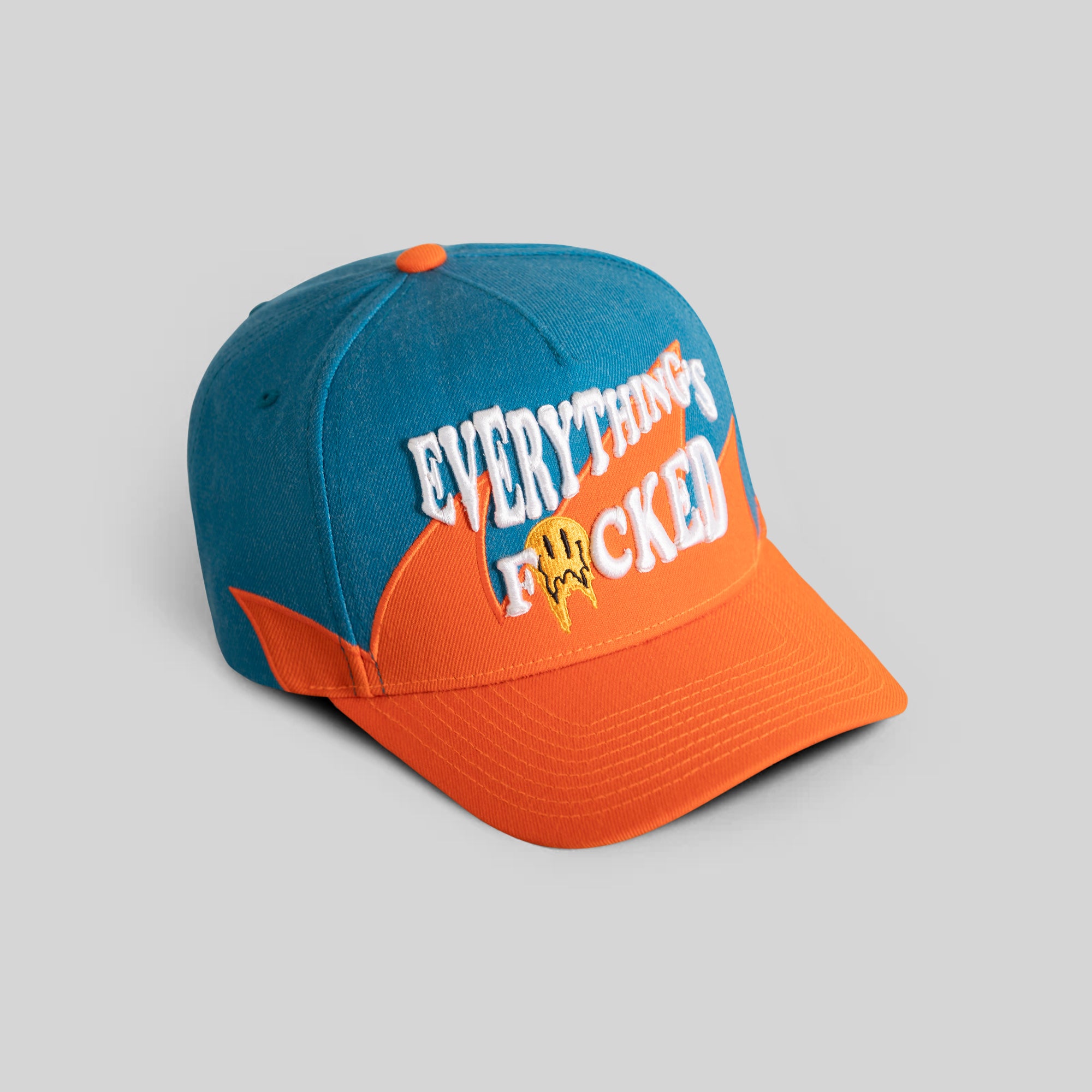 EVERYTHINGS F*CKED TEAL ORANGE SHARKTOOTH TRUCKER