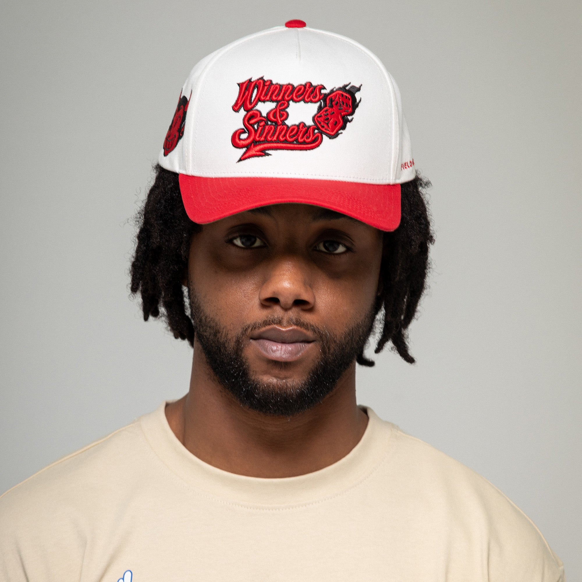 WINNERS AND SINNERS OFF WHITE VARSITY RED TWILL TRUCKER