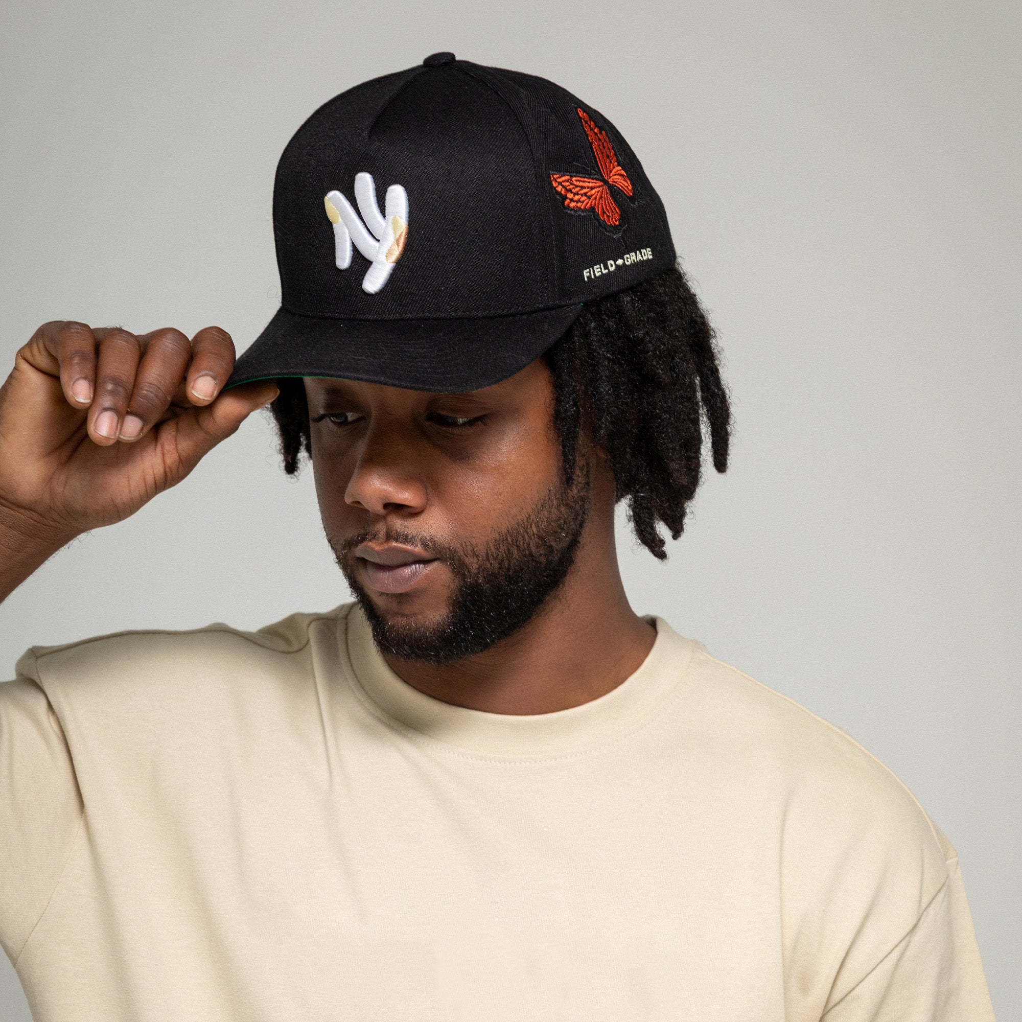 FIELD GRADE X KURVE STUDIO NY IS HEALING BUTTERFLIGHT WOOL TRUCKER