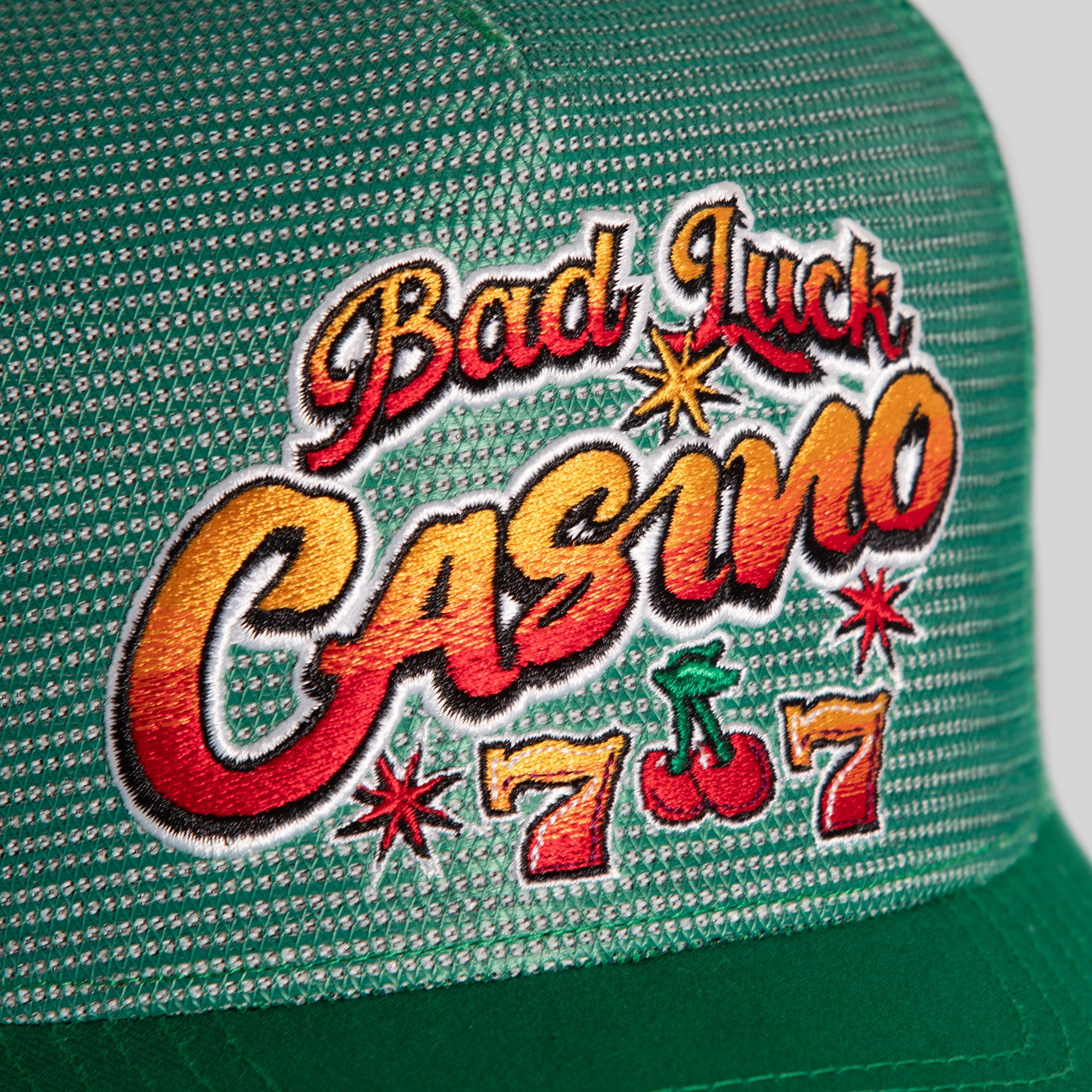BAD LUCK CASINO GREEN MESH CROWN TRUCKER