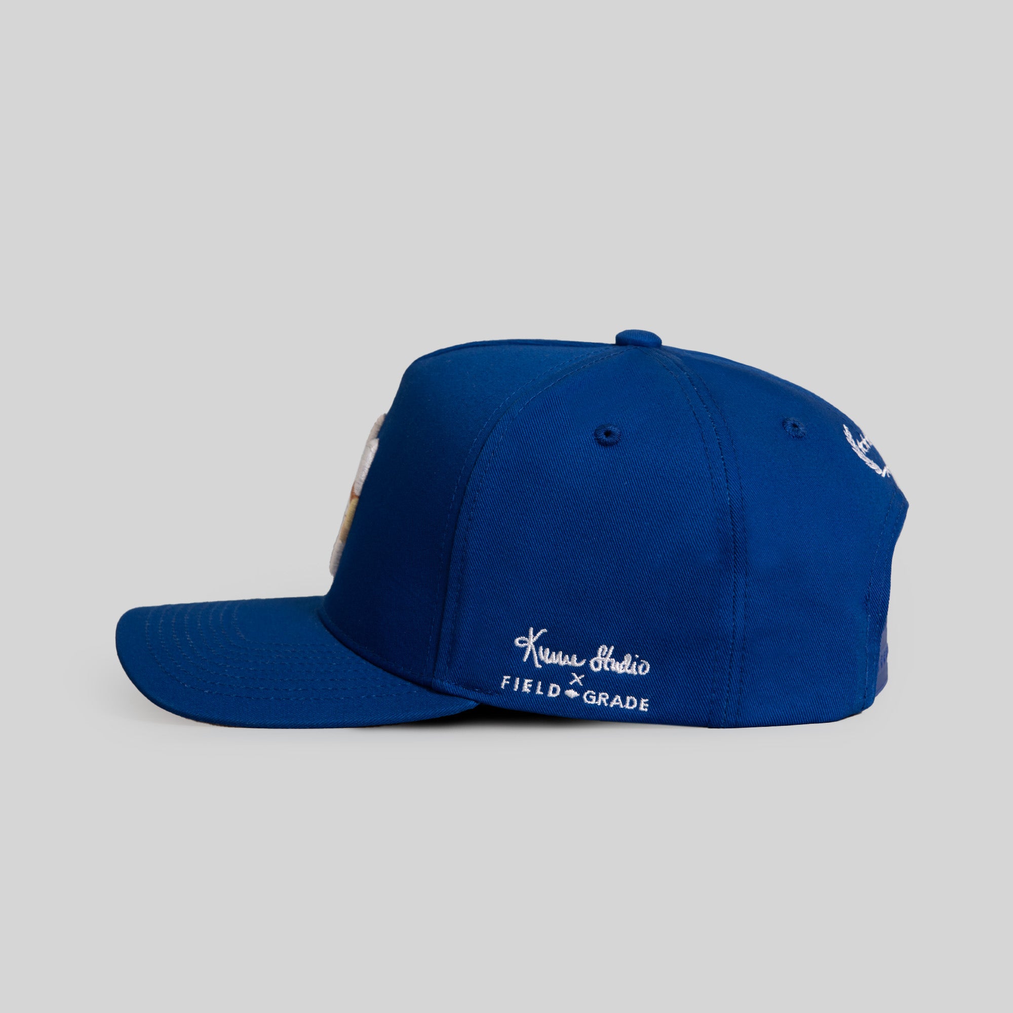 FIELD GRADE X KURVE STUDIO NY IS HEALING ROYAL TWILL TRUCKER