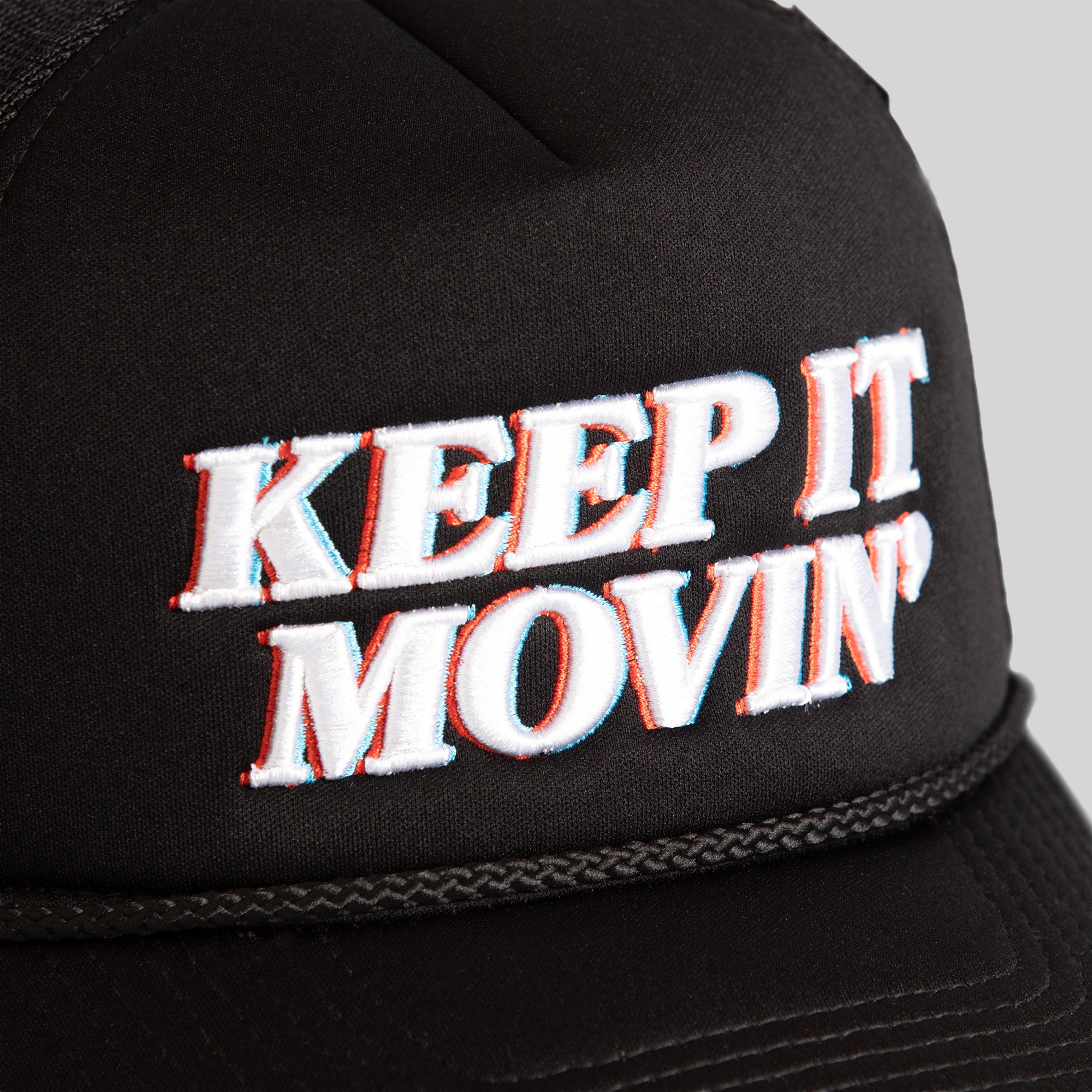 KEEP IT MOVIN' BLACK TRUCKER HAT