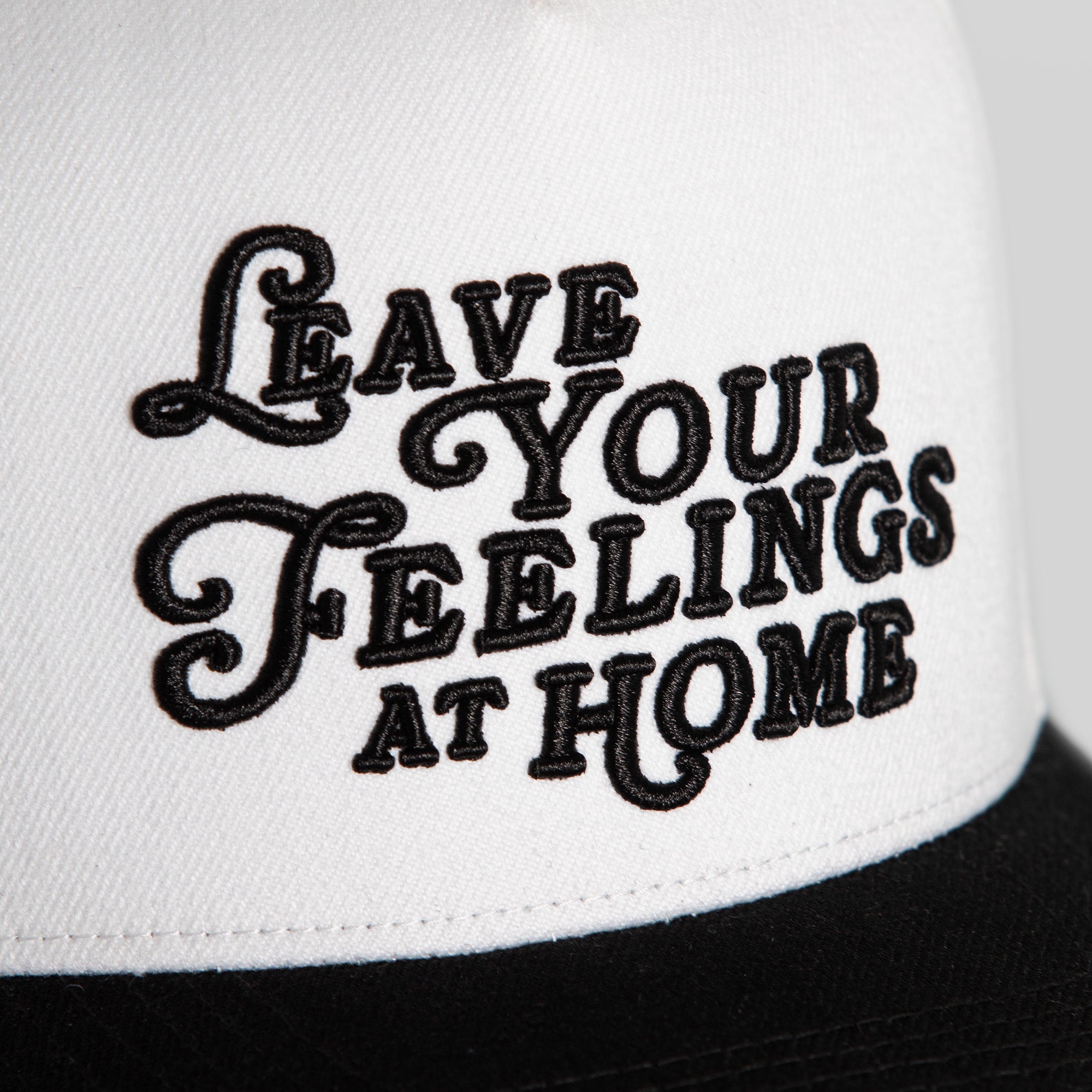 LEAVE YOUR FEELINGS OFF WHITE BLACK WOOL TRUCKER
