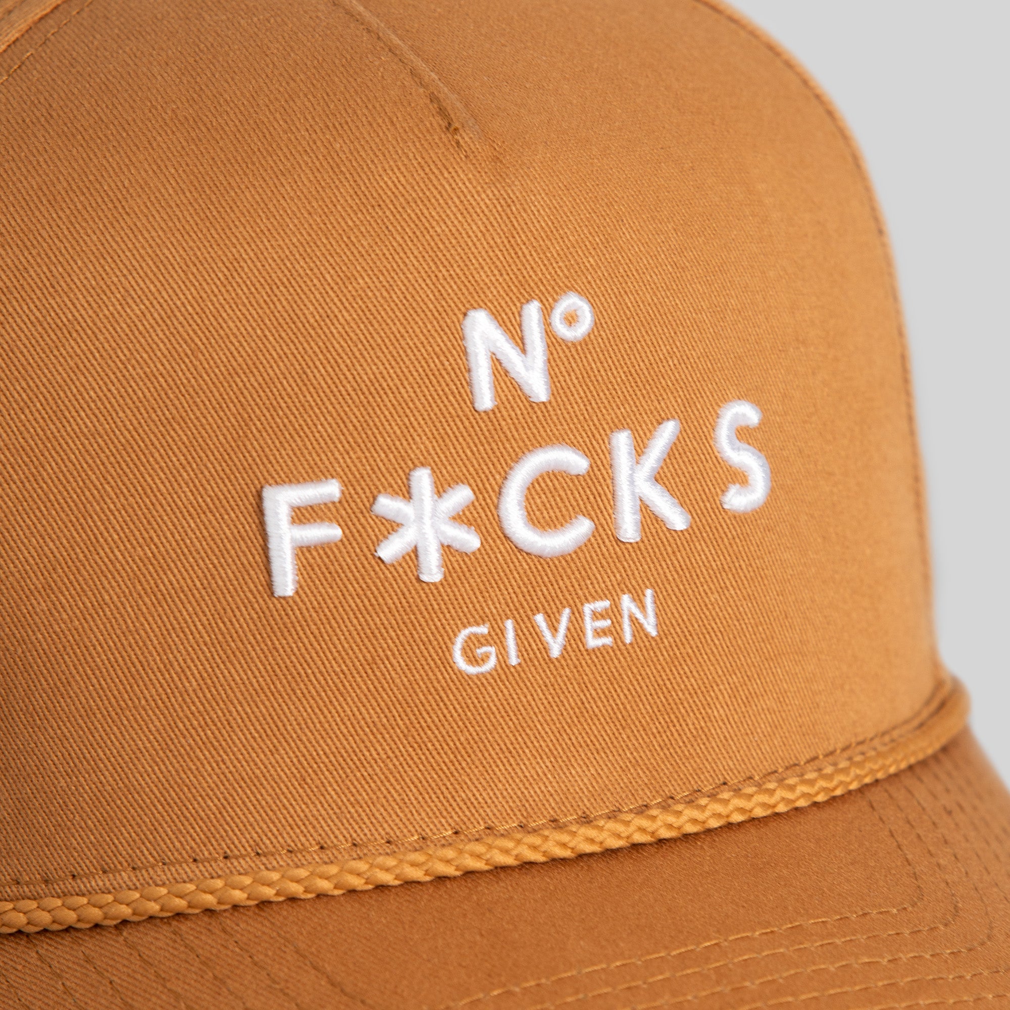 NO F*CKS GIVEN WHEAT TWILL TRUCKER HAT