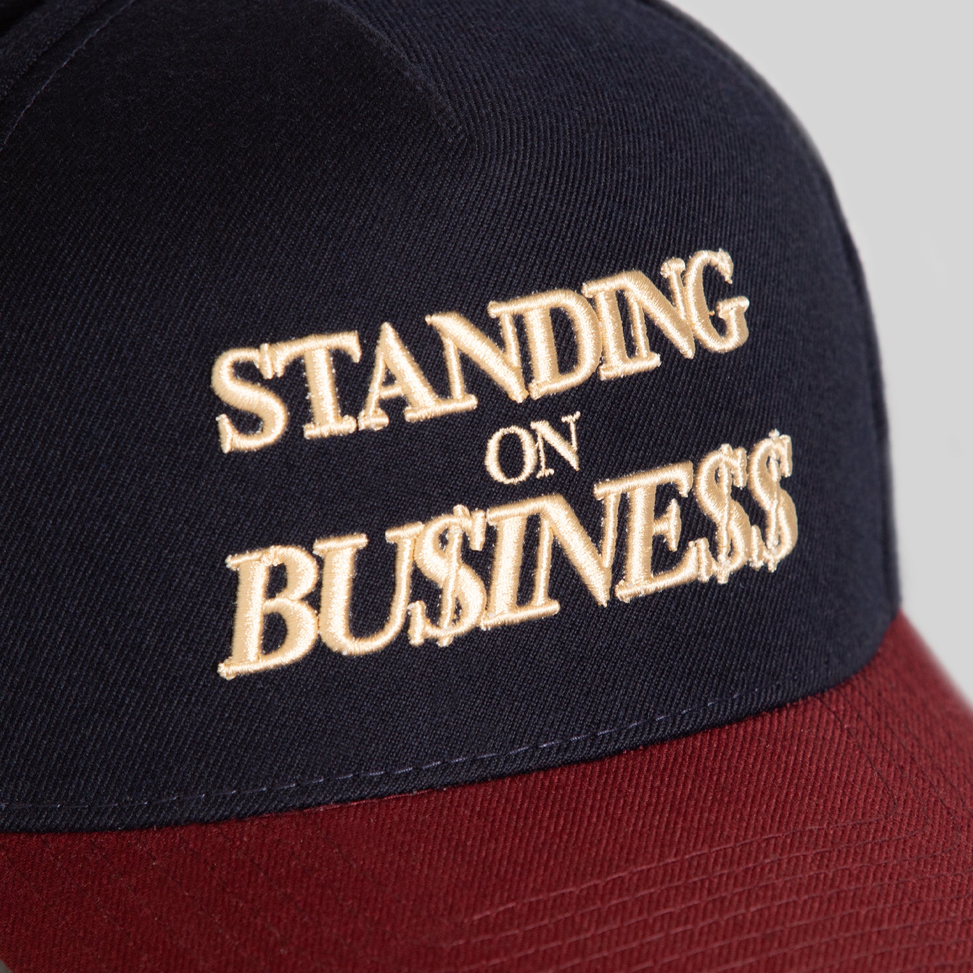 ON BUSINESS BORDEAUX DEEP NAVY WOOL TRUCKER HAT