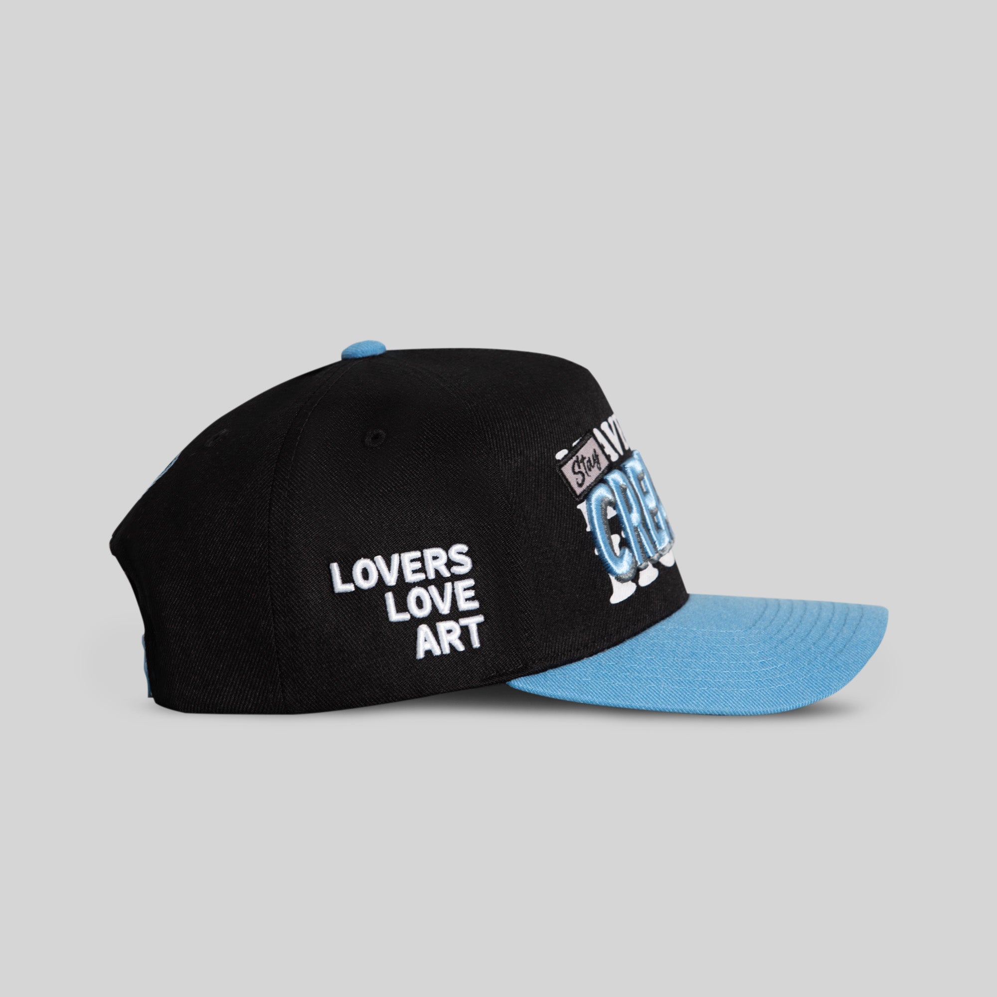 STAY CREATIVE BLACK UNI BLUE WOOL TRUCKER