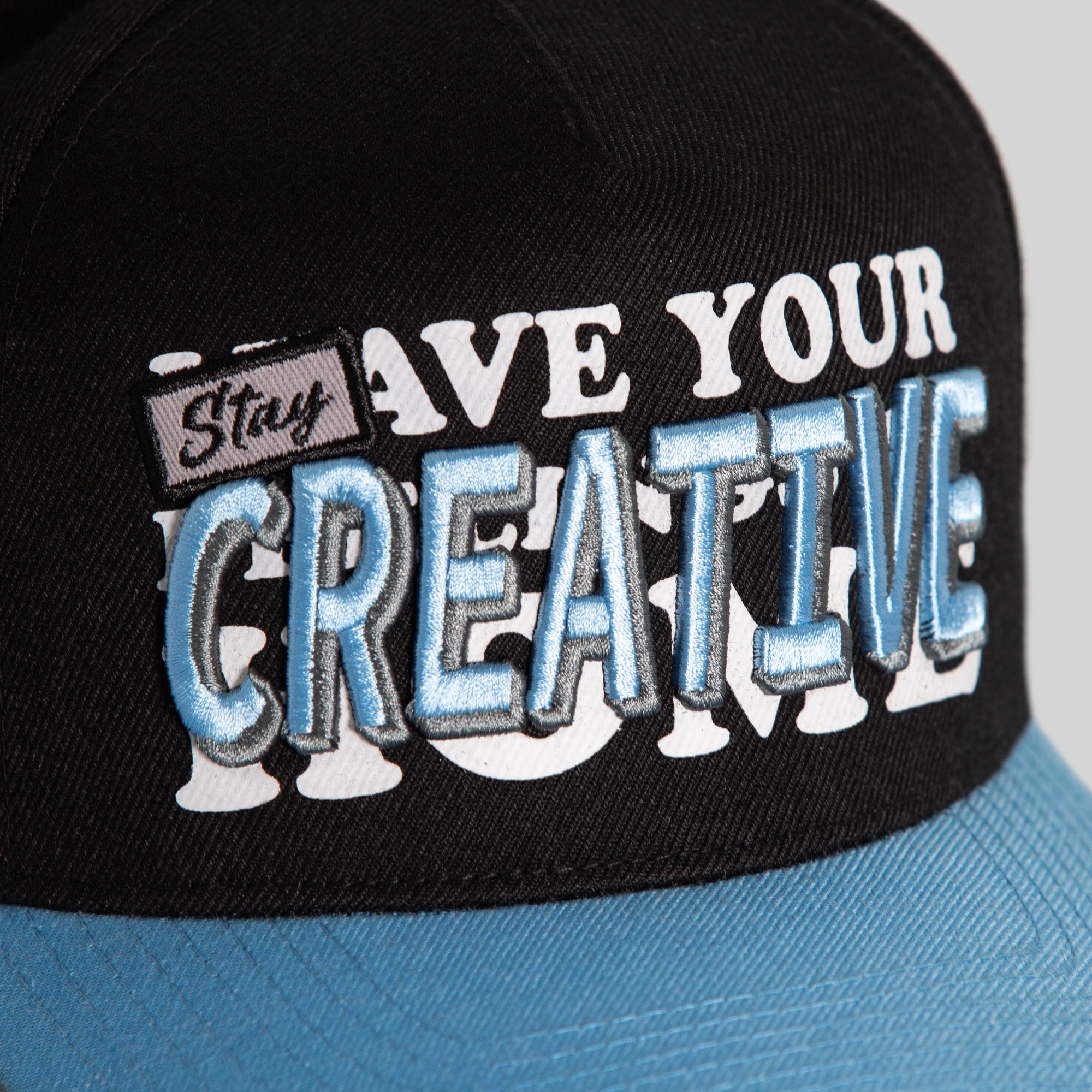 STAY CREATIVE BLACK UNI BLUE WOOL TRUCKER